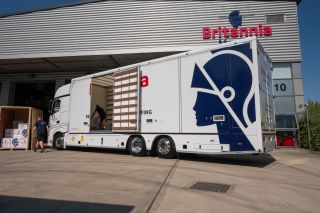 A Britannia Movers truck moving a customer to the UAE via a shared container, unloading at the Britannia Movers shipping depot