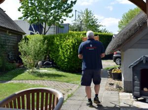 A Britannia Robbins crew member carrying a box during a move from the UK to Italy